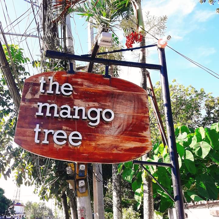 the mango tree sign